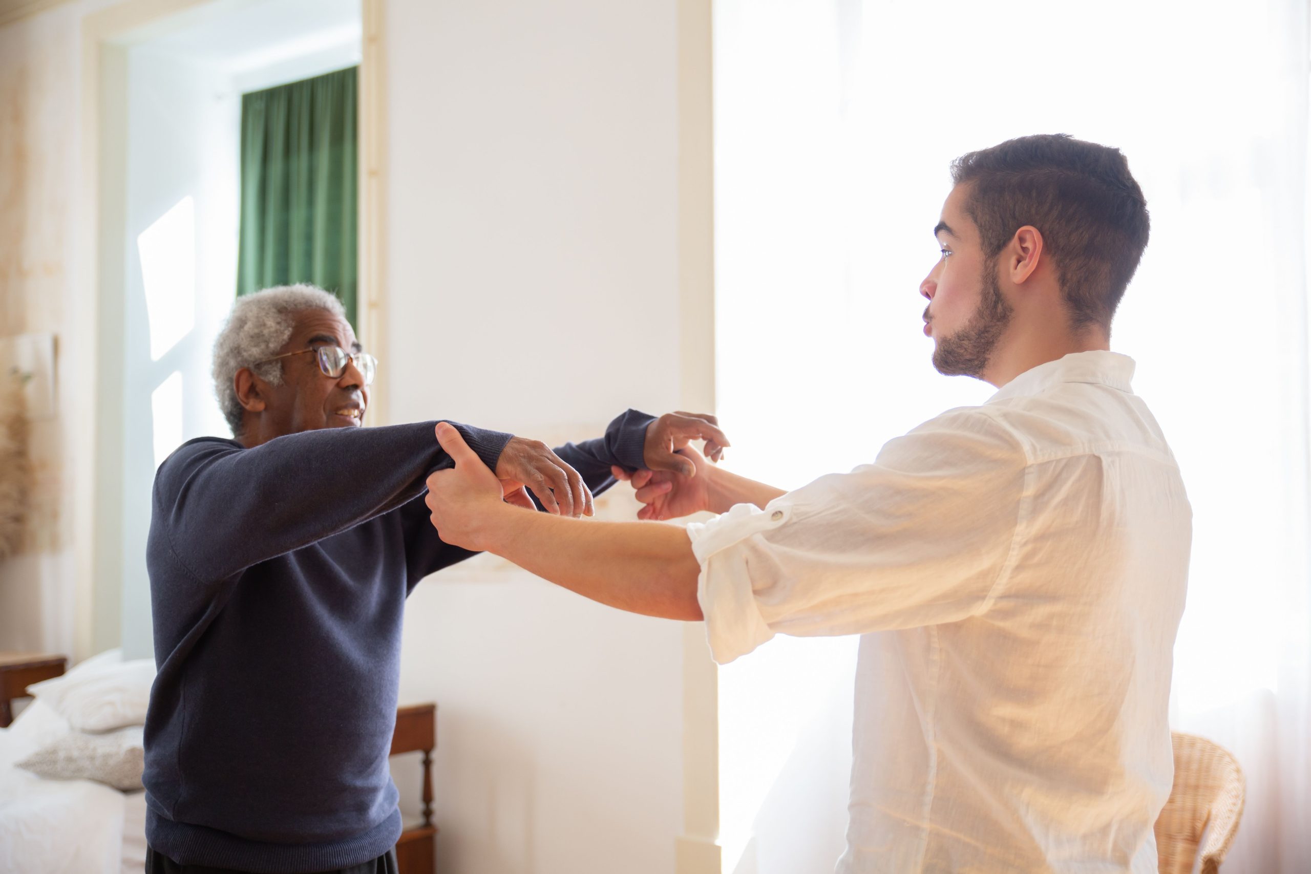 Female Caregiver taking care senior woman